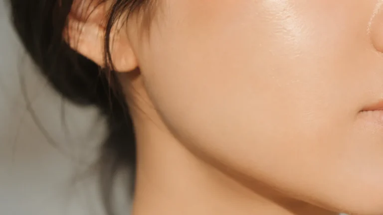 Close-up of even, brightened skin tone from White Tomato Extract supplement