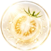 Glass orb with a halved white tomato in warm sunlight