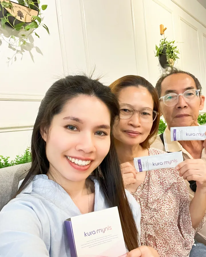 Kura Mynis customer holding a sachet