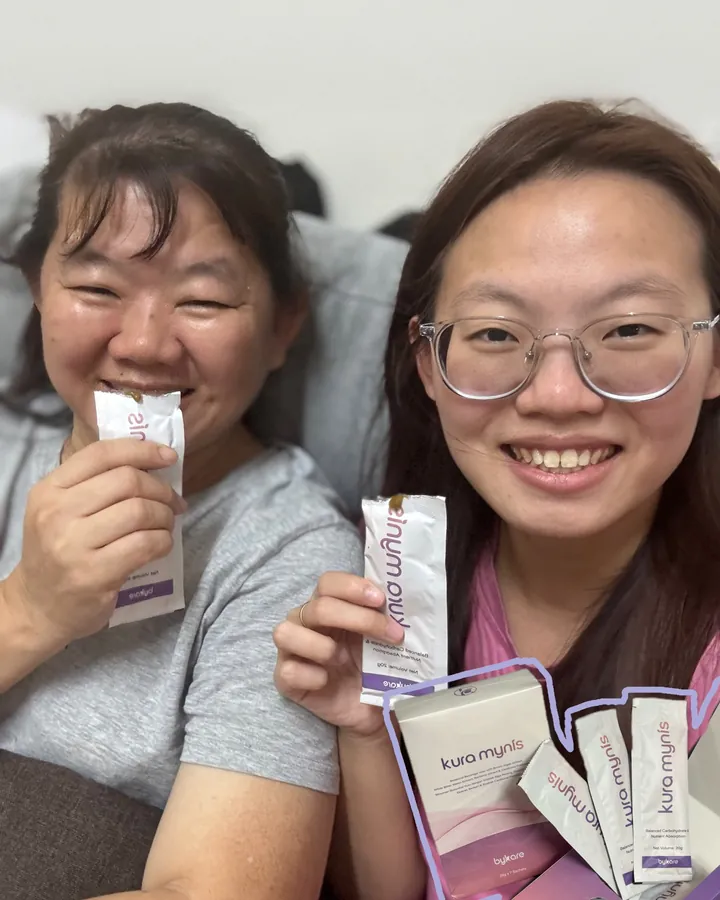 Kura Mynis customer holding a sachet